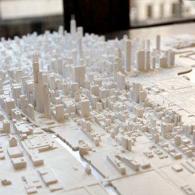 Close-up of Microscape's downtown Chicago model bonded to a 36" x 36", 1/8" thick plate of aluminum. The aluminum forms the surface of Lake Michigan and the Chicago River.
